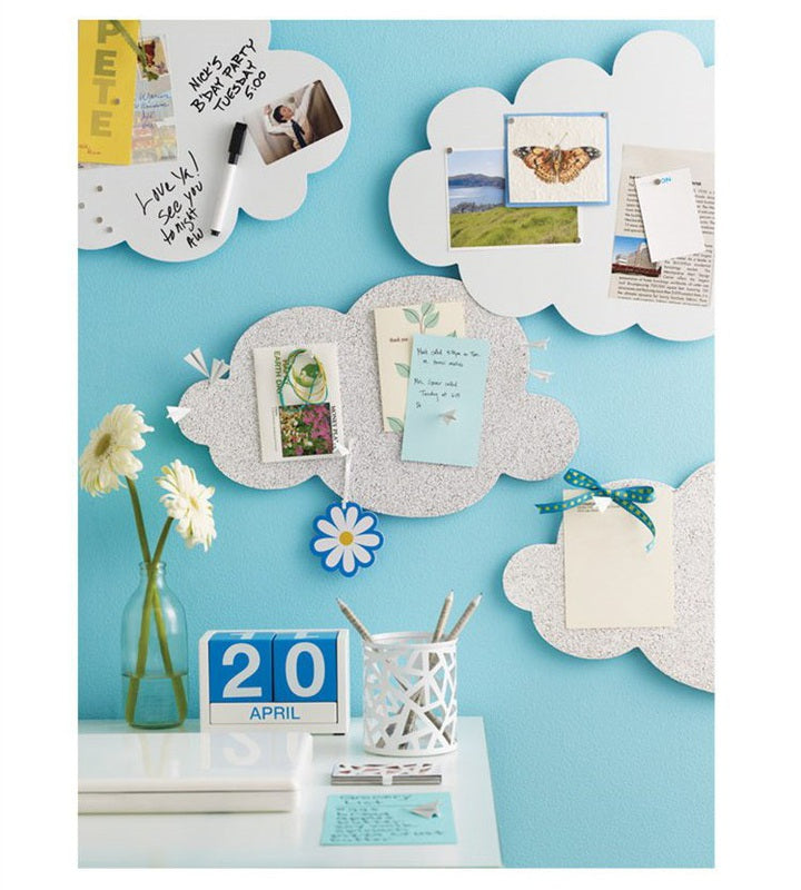 Paper airplane design pins on a bulletin board